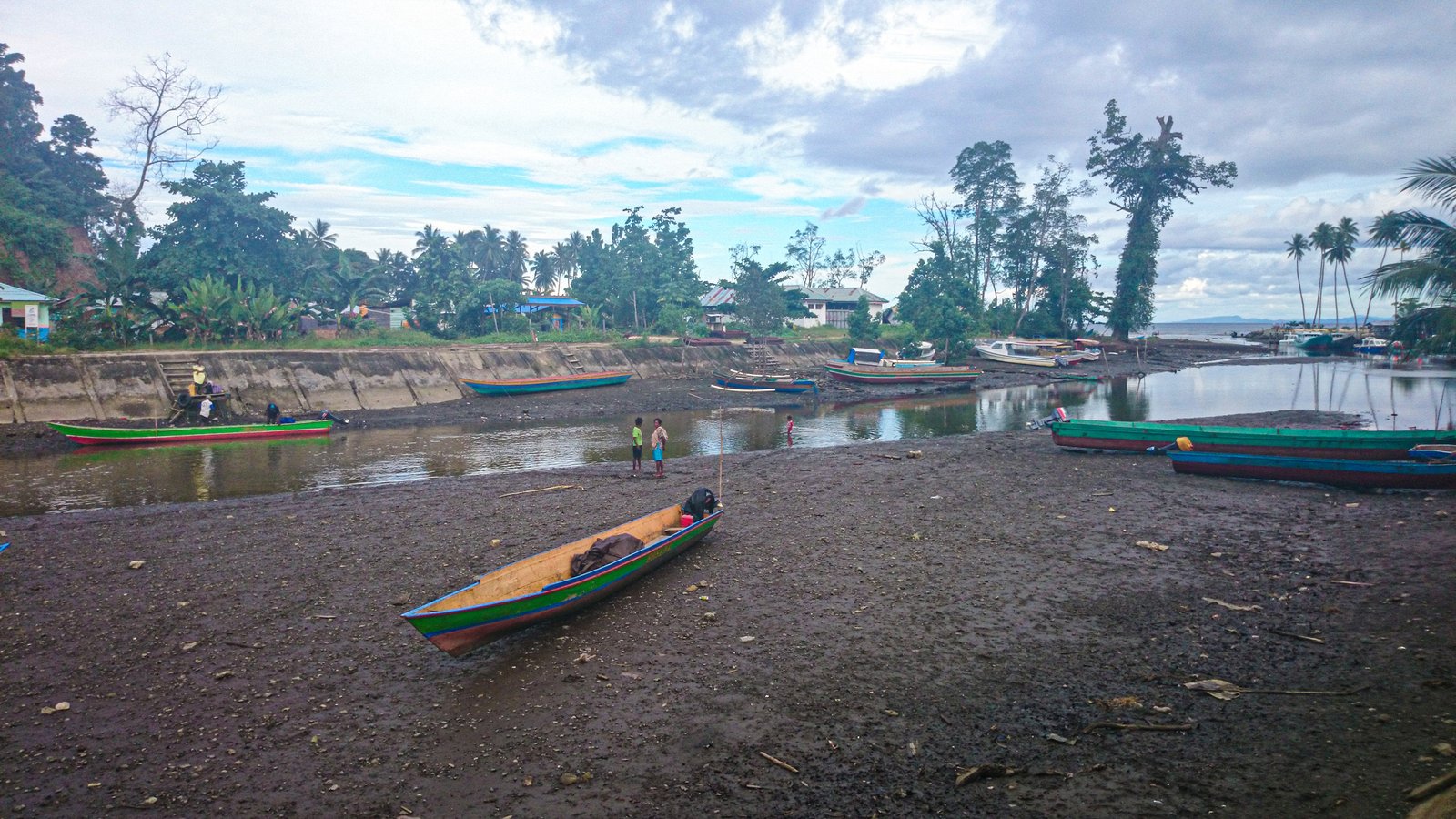 Boat on exposed tidal ground in Raja Ampat